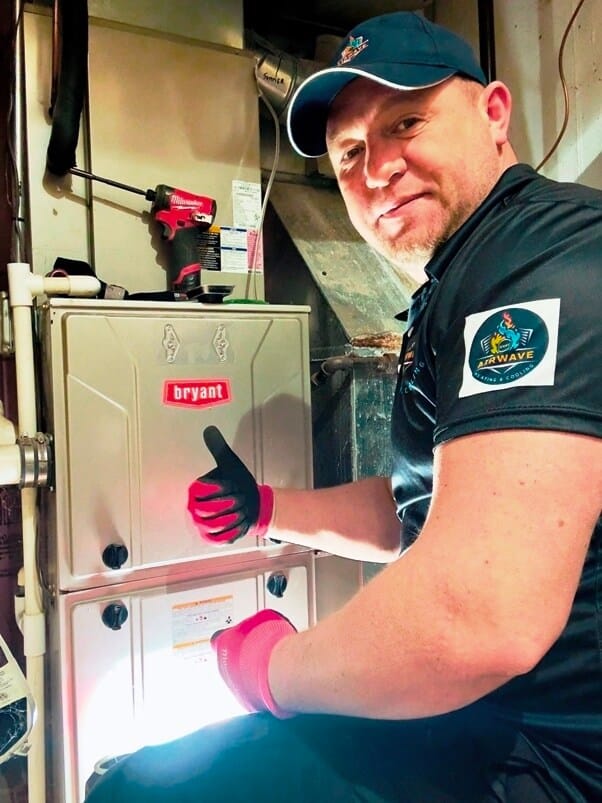 igor founder and owner repairing furnace